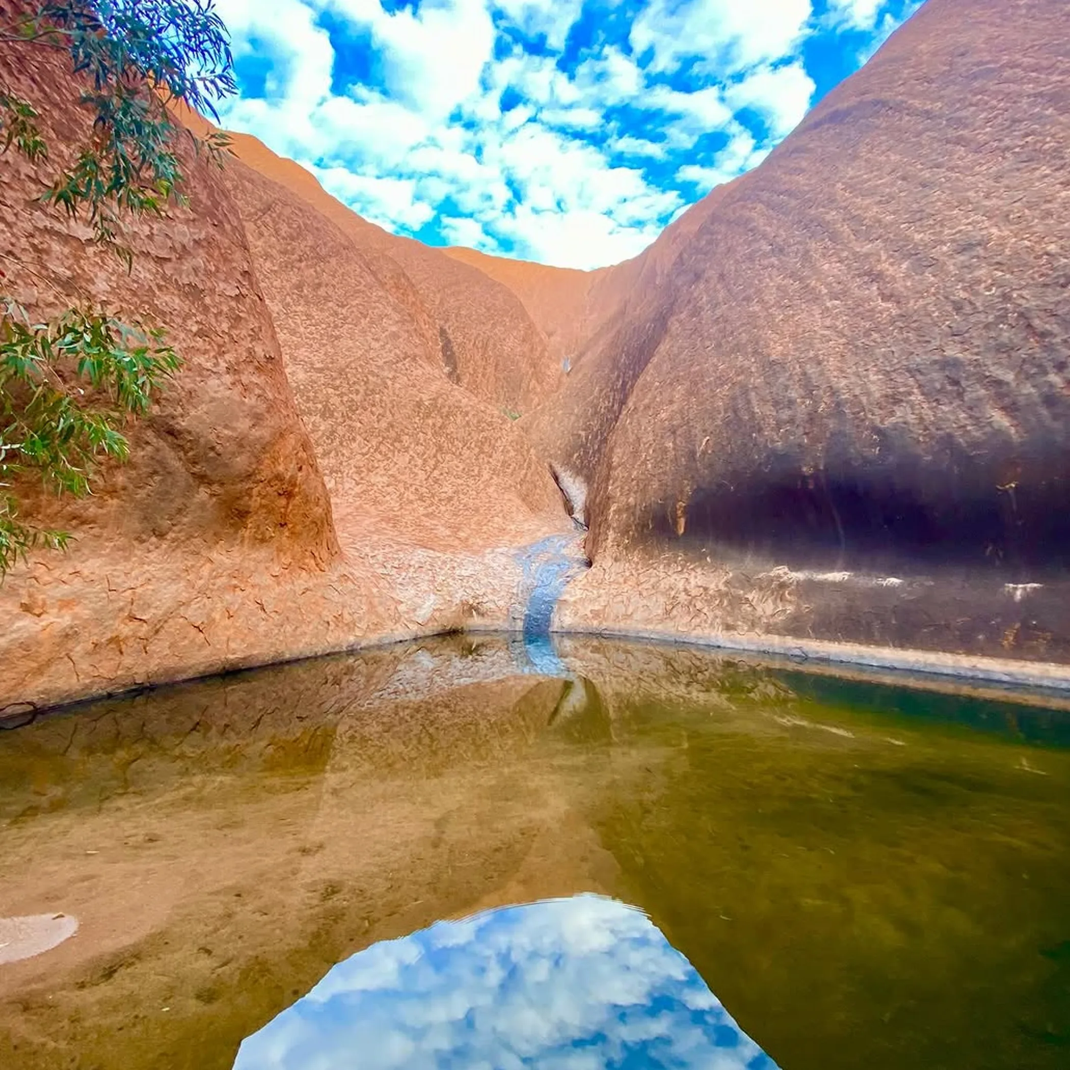 mutitjulu waterhole with sky reflection