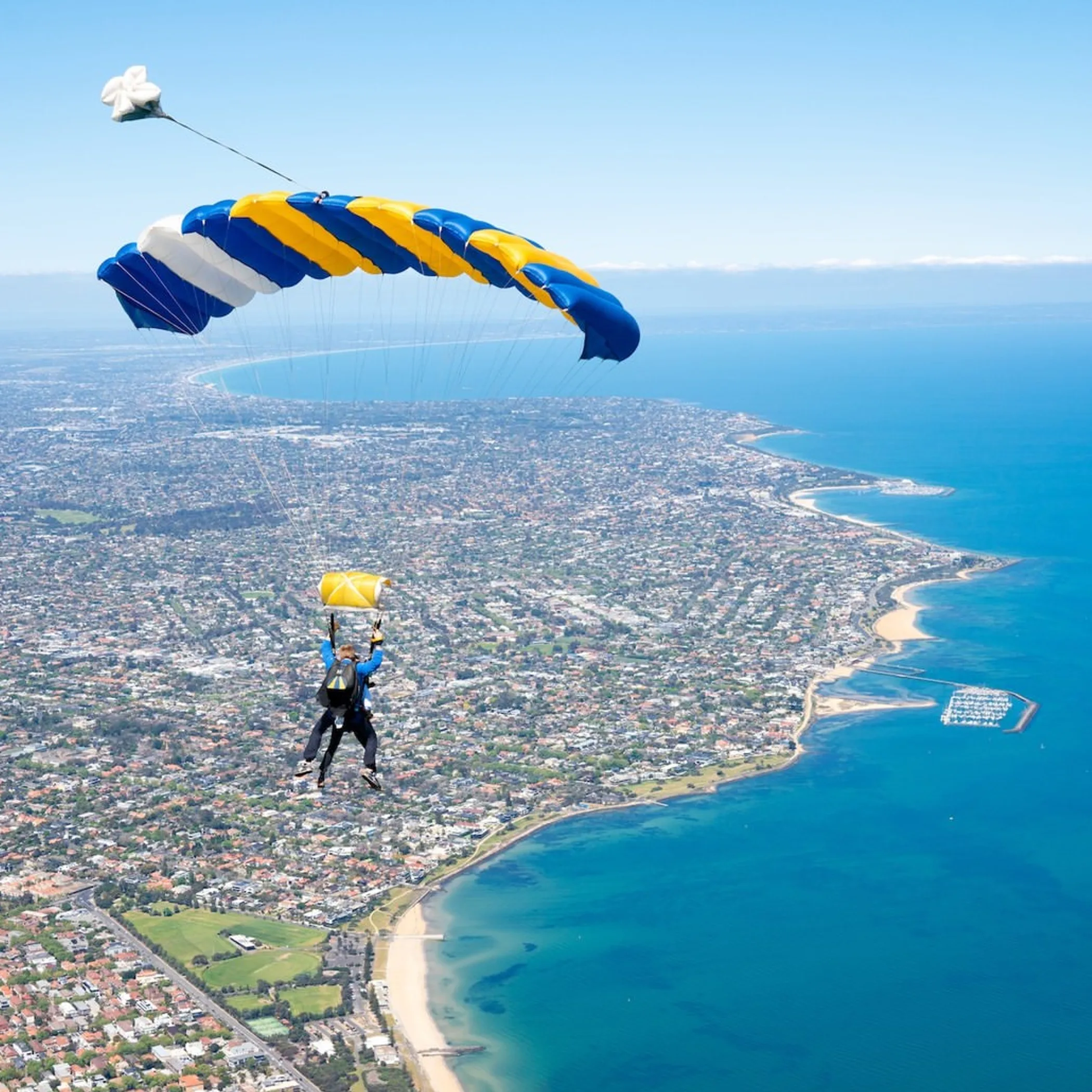 skydiving over coastal views